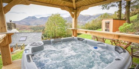 Guests at the holiday home can enjoy golfing and cycling nearby, or make the most of the garden. . Holidays in snowdonia with hot tub